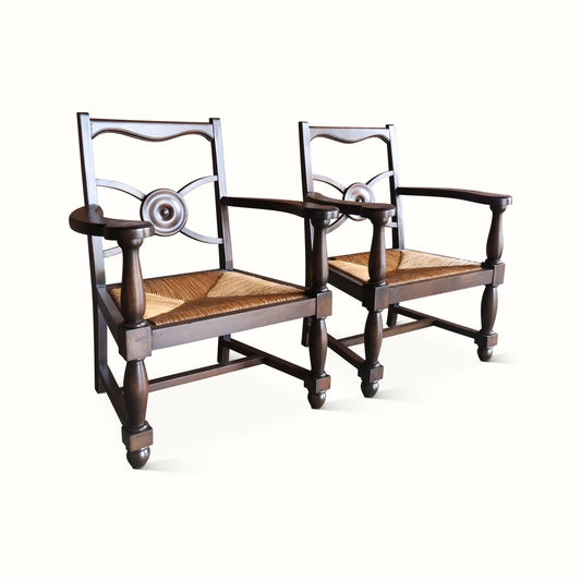 Fauteuils en chêne et jonc, signés Charles Dudouyt