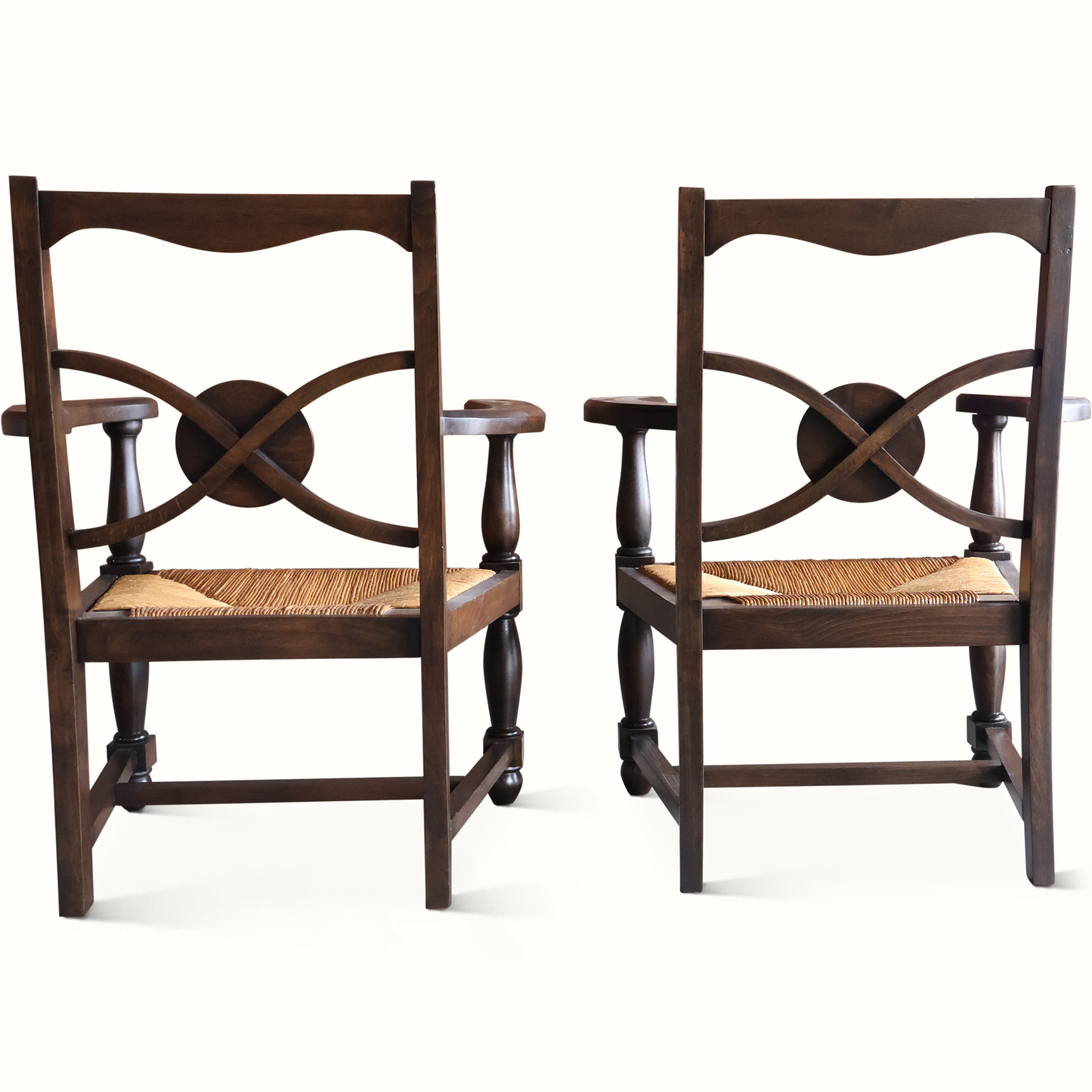 Fauteuils en chêne et jonc, signés Charles Dudouyt