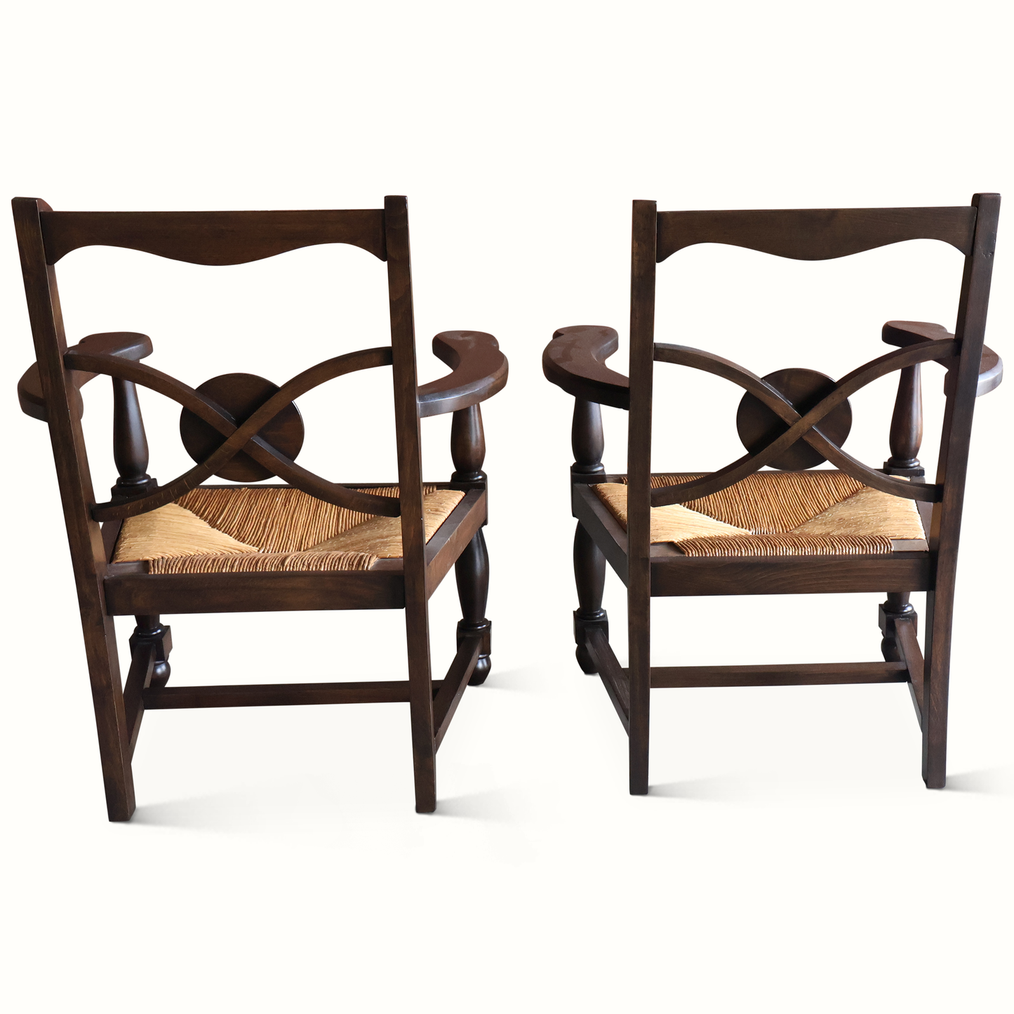 Fauteuils en chêne et jonc, signés Charles Dudouyt