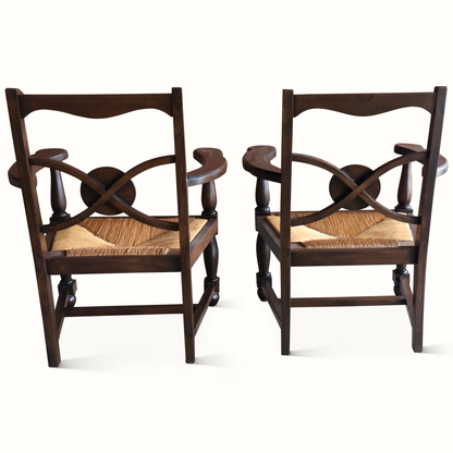 Fauteuils en chêne et jonc, signés Charles Dudouyt