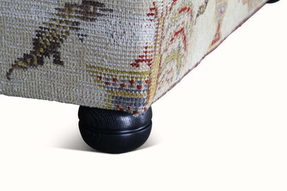 Pouf rembourré dans un tapis Khotan antique du XIXe siècle