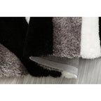 Tapis à poils longs Mateos au design abstrait