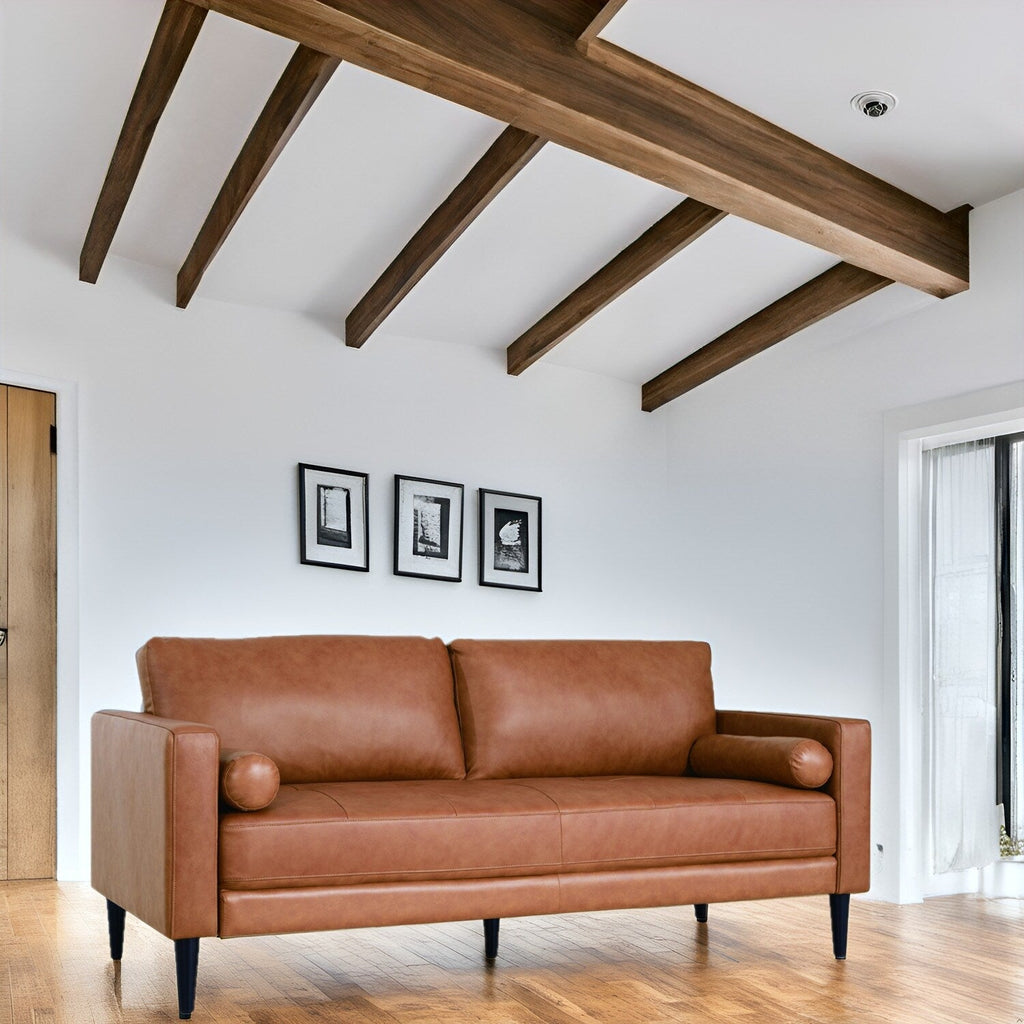 Canapé moderne en cuir véritable avec pieds en bois et coussin traversin supplémentaire