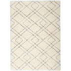 Tapis Nourison luxueux à poils longs et ultra moelleux, motif géométrique abstrait